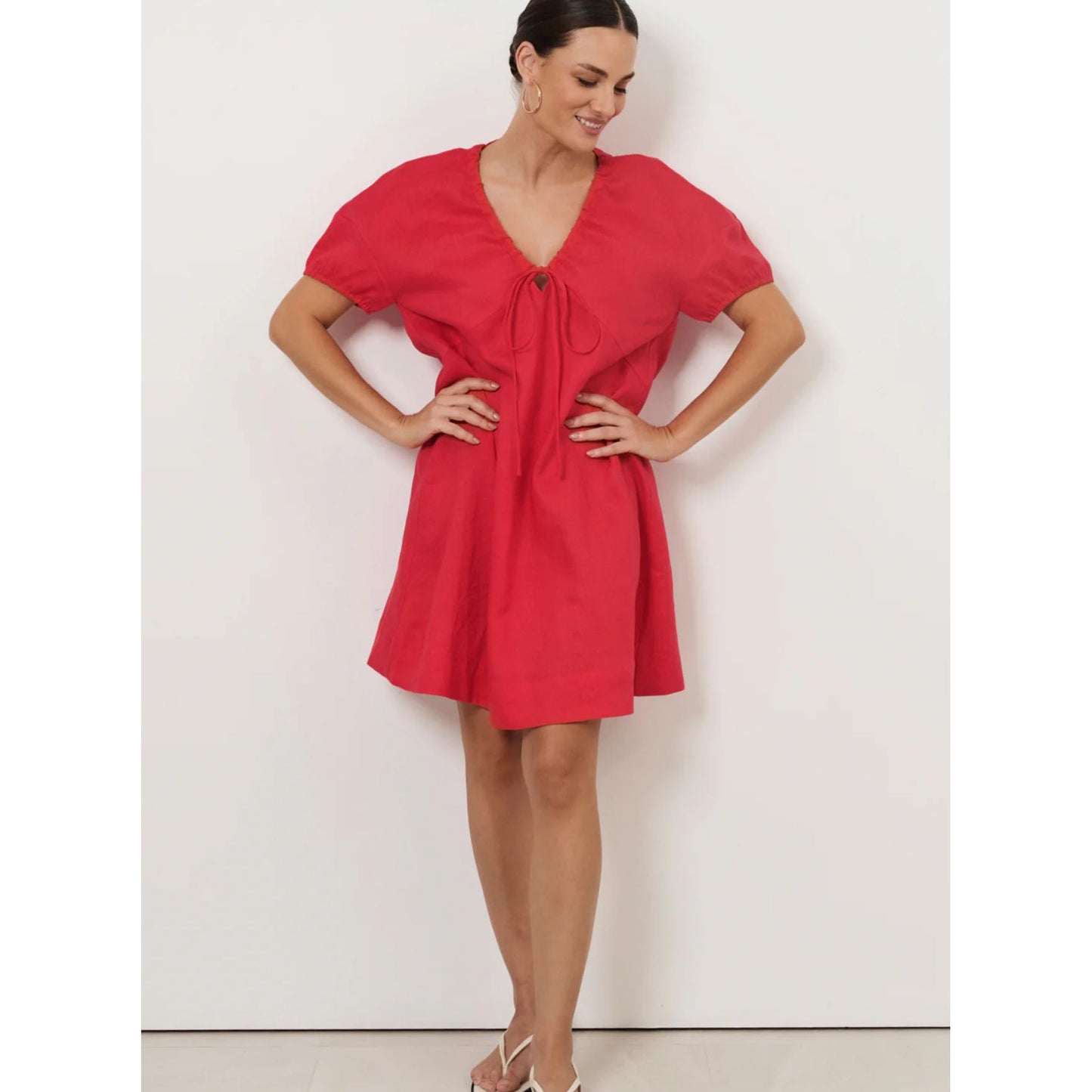 Model wearing merry red dress