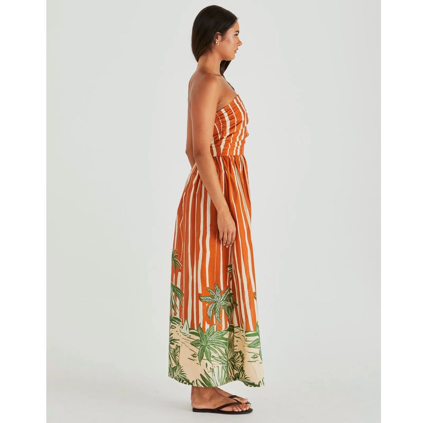 Side view of model in mina maxi dress