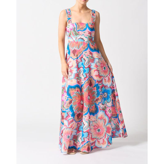 Woman wearing a colorful floral dress on a white background